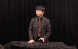義間拓也